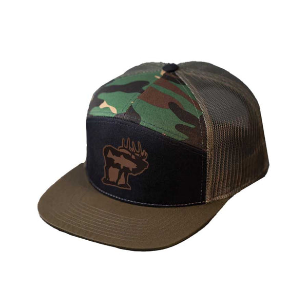 Camo and brown 7-panel trucker hat with mesh back and leather elk patch on front panel.