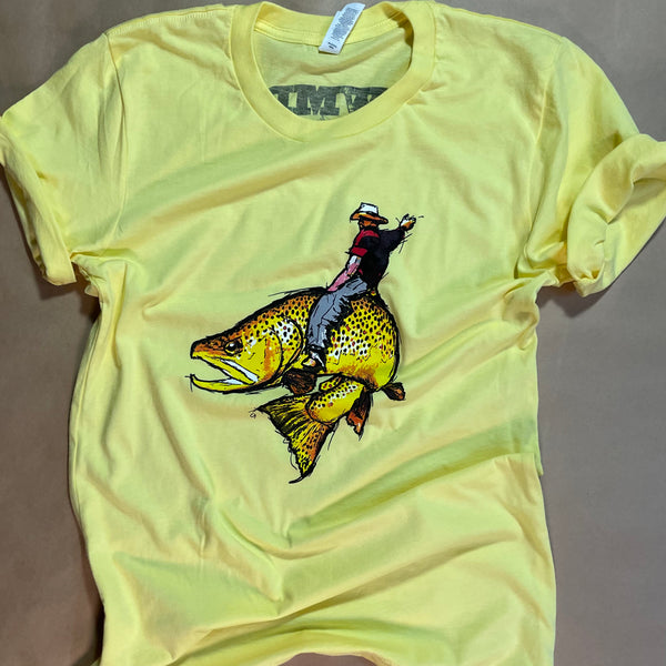 Yellow t-shirt with graphic of bull rider on a large spotted fish in vintage style.